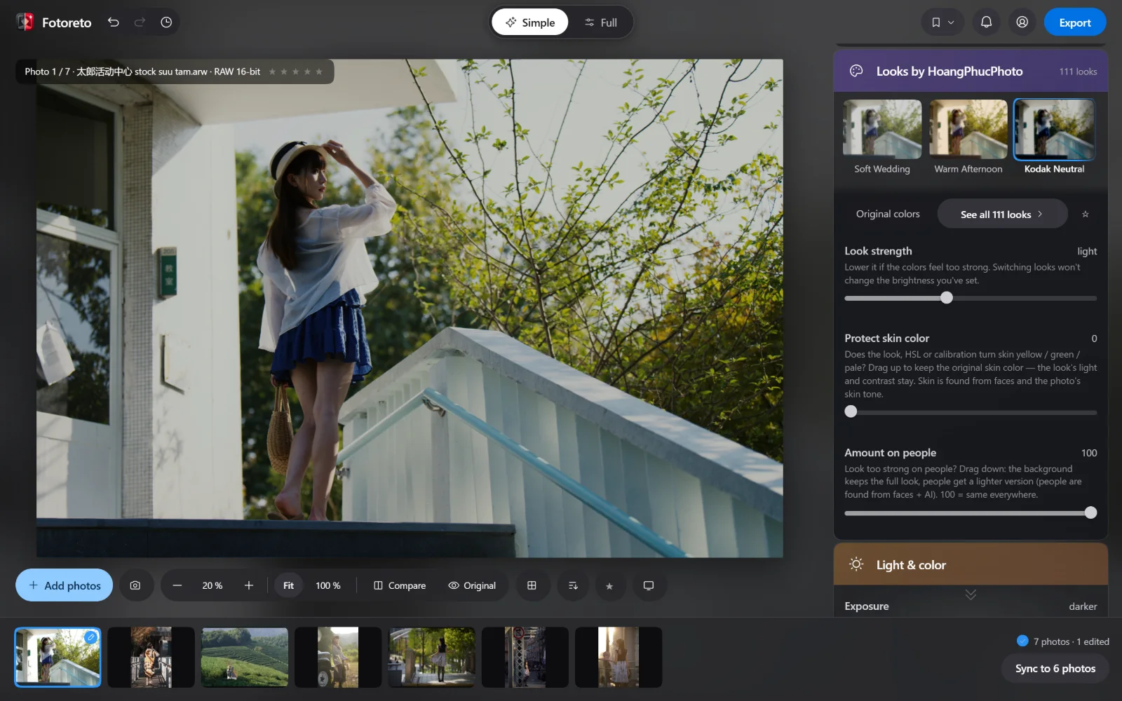 A sample photo edited in Fotoreto: an outdoor portrait, the look column on the right with Kodak Neutral selected, a filmstrip of 7 RAW files below